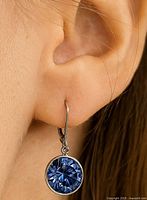 Earring worn to show size and style