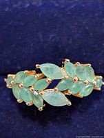 Top view showing emerald cluster design