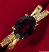 Top view of ring showing garnet and accent stones