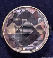 Top view showing faceted amethyst stone