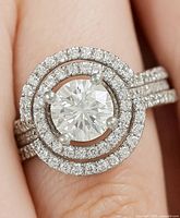 Top view of ring showing moissanite center, double CZ halo, split shank