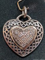 front view of heart pendant showing lattice design and pavé stones