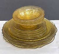 Stacked view of amber glass plates and bowls