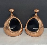front view of both bookends showing copper finish and hollow centers