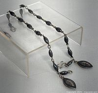 Both Siam niello bracelets laid out to show length and link style