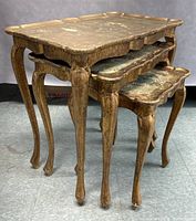 Front angled view showing full nested set of three tables