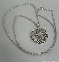 Full view of sterling silver necklace with pendant