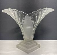 Front view showing flared scalloped rim and frosted base