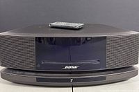 Front view of Bose Wave Music System IV with remote placed on top