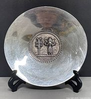 Front view of silver plate on stand