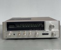 Front view showing entire receiver, controls and dial