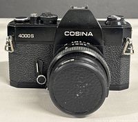 Front view Cosina 4000S body with lens cap on