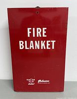 Front view of red Pulmosan fire blanket cabinet