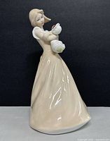 Full front view of entire figurine showing overall form and glaze