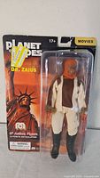 Front view of sealed Dr. Zaius figure on card