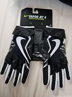 Front view of pair of Nike Vapor Jet 4 gloves on card