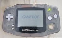 Front view of powered-on Nintendo Game Boy Advance showing screen and controls