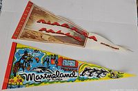 Both pennants laid out full length on white background