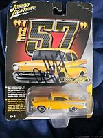 Front view of sealed Johnny Lightning Jeff Lutz car with signature