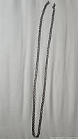 Full view of sterling silver chain laid flat showing length