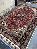 Full view of rug showing entire pattern and borders