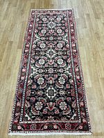 Full view of Malayer runner rug on wood floor