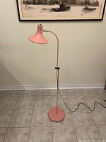 Full view of lamp showing base, stem, shade, cord