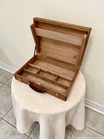 Case open showing interior compartments and palette support