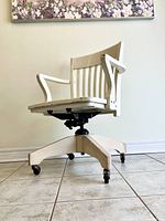 Front angled view showing full chair, base, casters