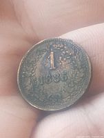 Obverse showing numeral 1, date and wreath design