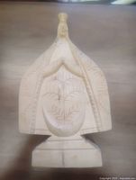 Front view of entire carved wood figure