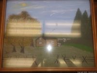 Front view of framed painting showing rural scene and frame