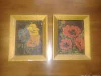 Front view of both framed floral paintings