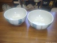 Both 7-inch glazed pottery bowls side by side on table