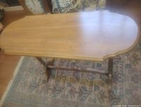 Top view of console table showing rounded ends and wood grain.