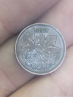 Reverse showing 1 CENT, maple leaves, date 1938, CANADA legend