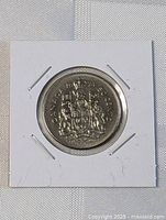 Reverse of 1974 Canada 50-cent coin in 2x2 flip