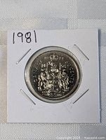 Full view of 1981 Canadian 50-cent coin in holder