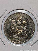 Reverse of 1983 Canadian 50-cent coin showing Coat of Arms