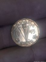 Reverse side with torch, V, date and CANADA inscription