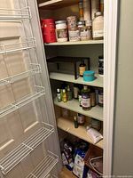 Full view of closet shelves showing variety of bath and body items