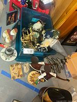 Overview of tote and assorted Christmas items on floor