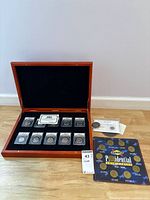 Wood case with 10 ANACS-graded coins, Sunoco token board, two loose coins