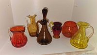 Group shot of six colored blown glass pieces