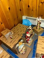 Group of five Jim Shore figurines with boxes visible