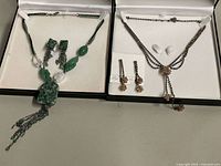 Both jewellery sets displayed in open FAC boxes