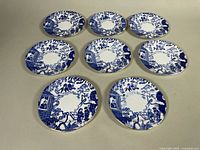 All seven Mikado Blue plates displayed