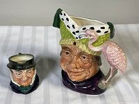Both Royal Doulton character pieces front view