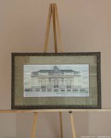 Full view of framed poster on easel