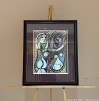 Front view of framed print on easel